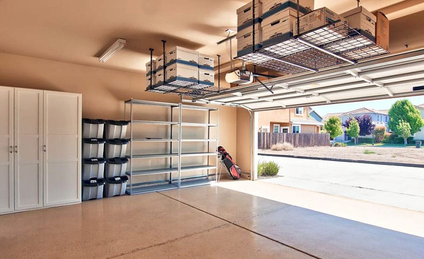 Garage with storage cabinets and overhead ceiling racks