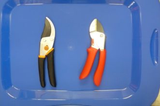 By-pass pruners, on the left, and anvil pruners, on the right, are recommended for cutting small twigs and branches up to one-half inch in diameter. 