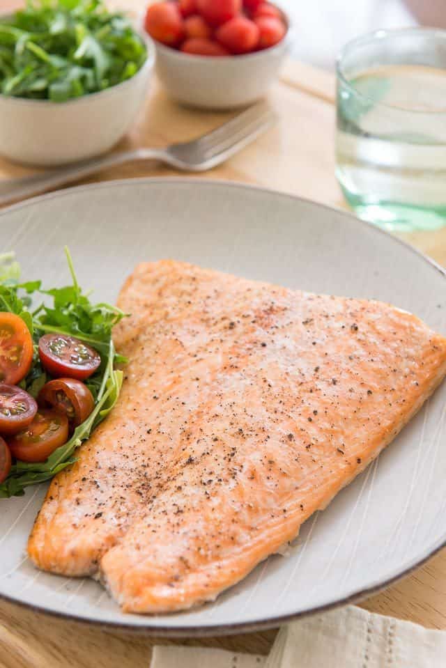 Baked Salmon - On a Plate with Tomatoes and Salad